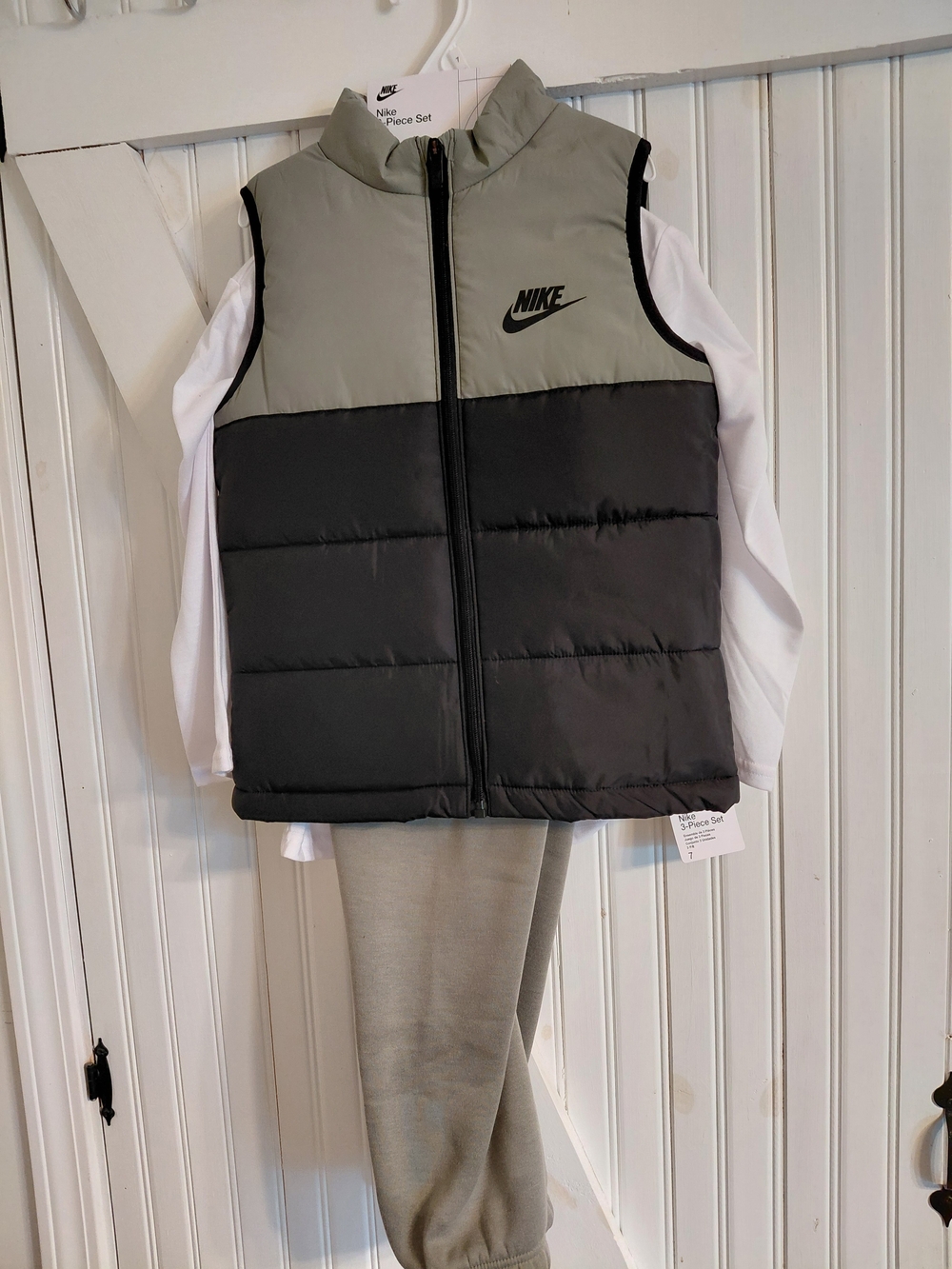 Nike Kids Light Gray & Black Puffer Vest With Pants And Shirt.